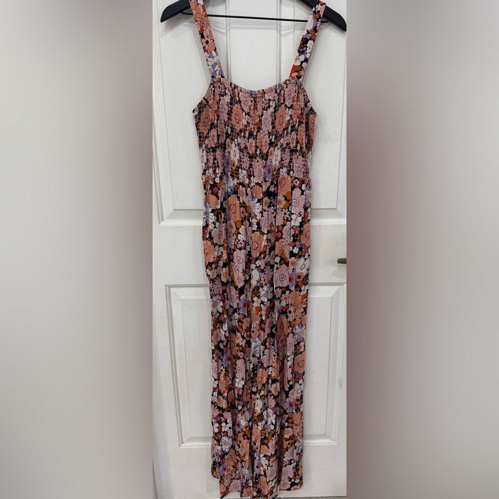 Women’s floral print jumpsuit with pockets. Wide leg, long pant romper.
